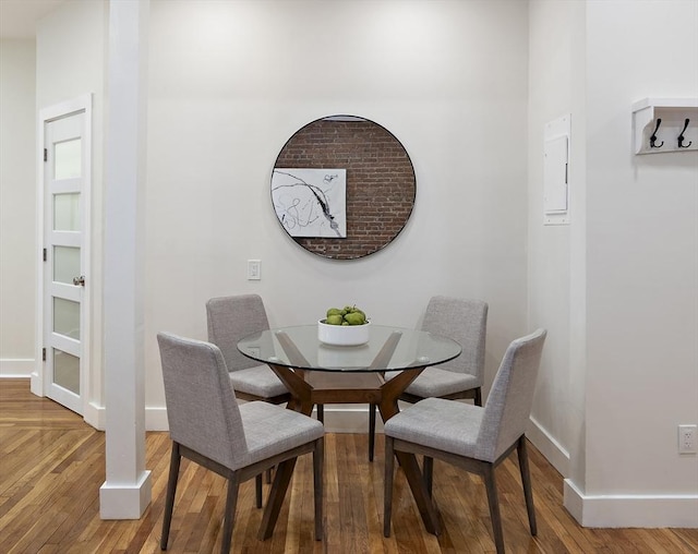 dining room with wood finished floors and baseboards