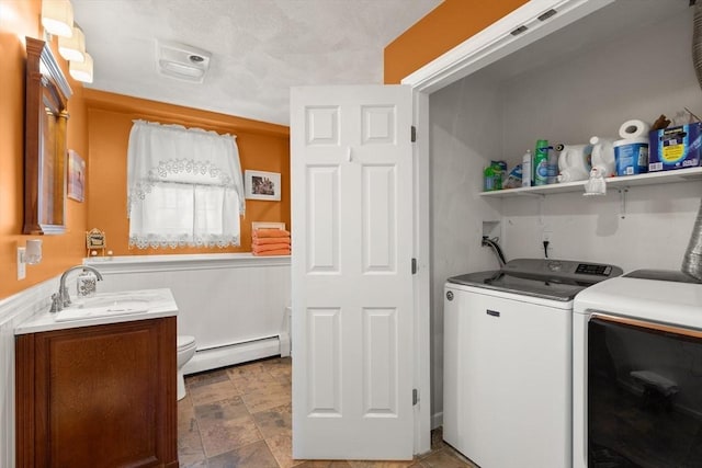 10 Lisa Ln, Reading, MA 01867 - laundry room featuring a baseboard radiator and separate washer and dryer