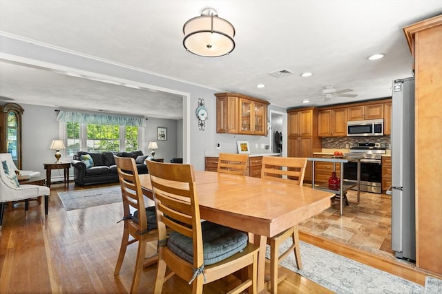 10 Lisa Ln, Reading, MA 01867 - dining area featuring recessed lighting, a ceiling fan, ornamental molding, and light wood-style flooring