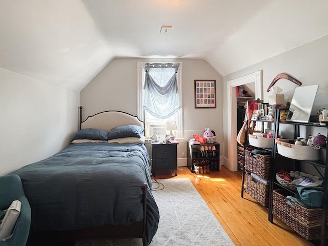 57 Bartlett St, Somerville, MA 02145 - bedroom with light wood-type flooring and lofted ceiling