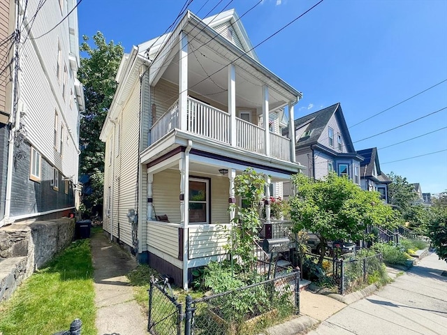 57 Bartlett St, Somerville, MA 02145 - view of front of property featuring a balcony and a porch