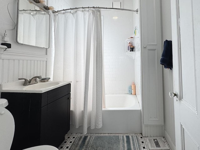 57 Bartlett St, Somerville, MA 02145 - bathroom featuring vanity, shower / tub combo with curtain, and tile patterned floors