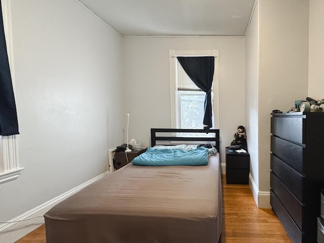 57 Bartlett St, Somerville, MA 02145 - bedroom featuring light wood finished floors and baseboards