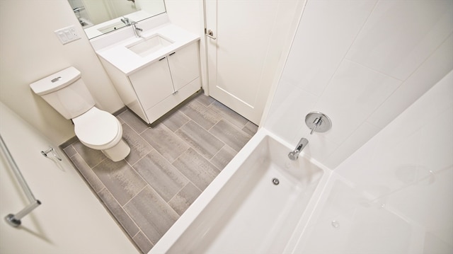 full bathroom with vanity, toilet, shower / bathtub combination, and hardwood / wood-style floors