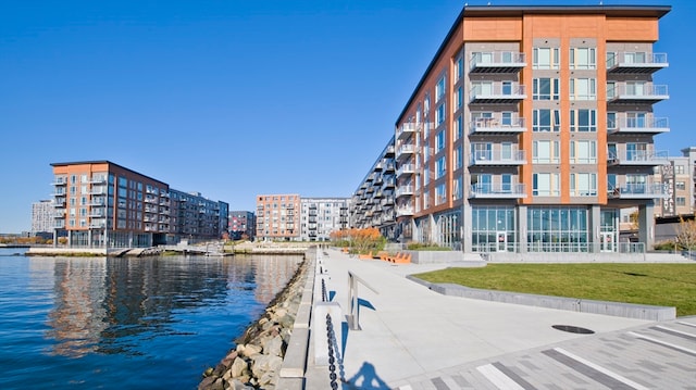 view of building exterior with a water view