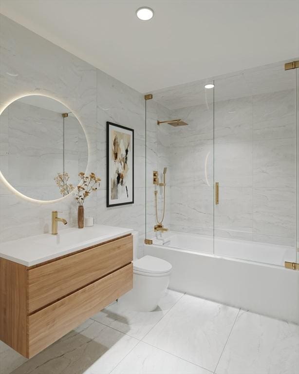 125 Lowell St Unit 2C, Somerville, MA 02143 - full bath with vanity, tub / shower combination, marble finish floors, recessed lighting, and tile walls