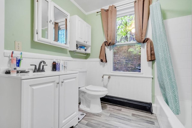 bathroom with toilet, shower / bath combo, a wainscoted wall, vanity, and ornamental molding
