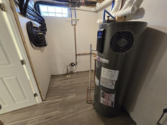 utility room featuring heat pump water heater