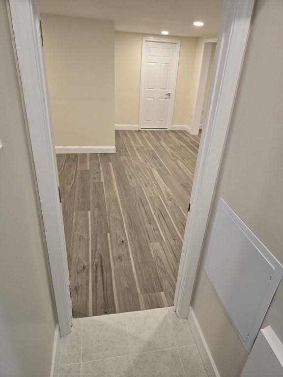 interior space with recessed lighting, baseboards, and wood finished floors