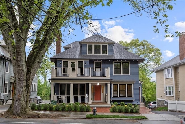 197-199 Winchester St, Brookline, MA 02446 - american foursquare style home featuring covered porch, a balcony, and a shingled roof