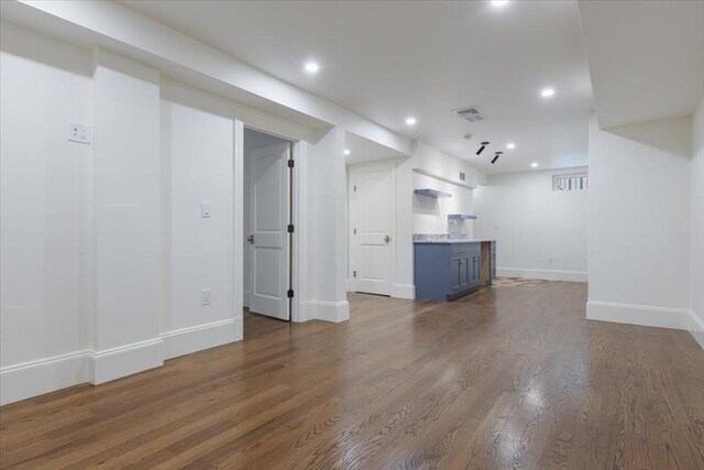 197-199 Winchester St, Brookline, MA 02446 - basement with baseboards, recessed lighting, and dark wood-style flooring