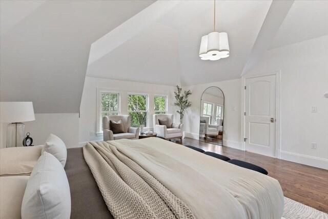 197-199 Winchester St, Brookline, MA 02446 - bedroom featuring vaulted ceiling, multiple windows, baseboards, and wood finished floors
