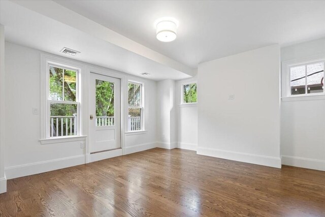 197-199 Winchester St, Brookline, MA 02446 - empty room featuring wood finished floors and baseboards