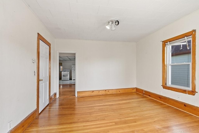 empty room with light hardwood / wood-style floors