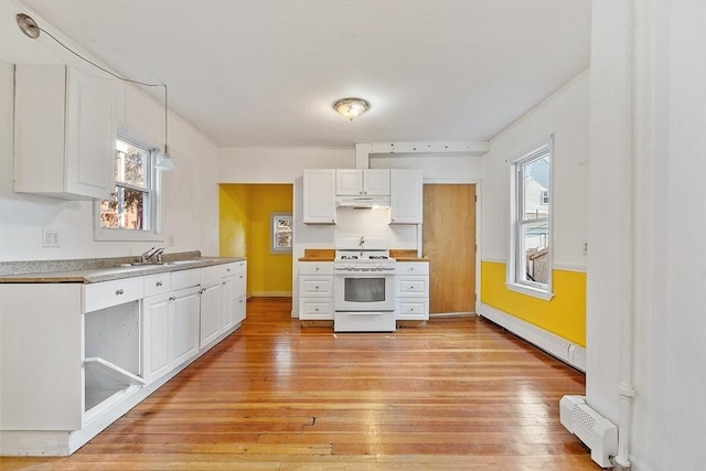 kitchen with baseboard heating, white cabinetry, white stove, light hardwood / wood-style floors, and decorative light fixtures