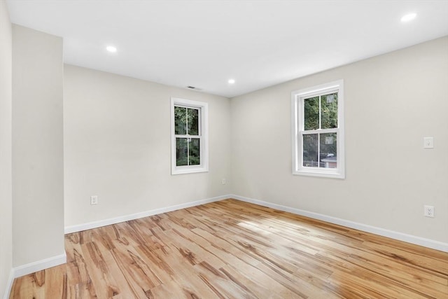 unfurnished room featuring light wood-type flooring