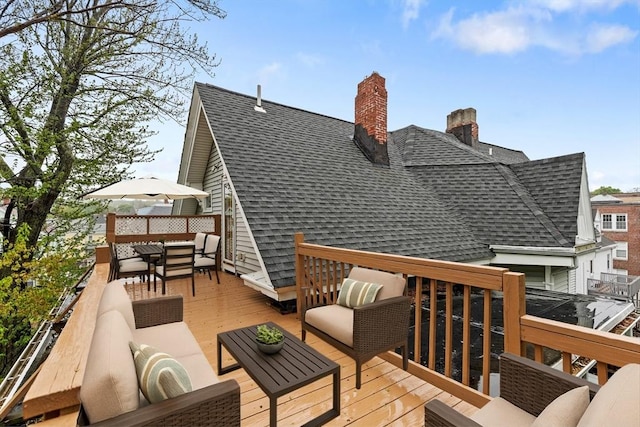 deck with an outdoor living space and outdoor dining space
