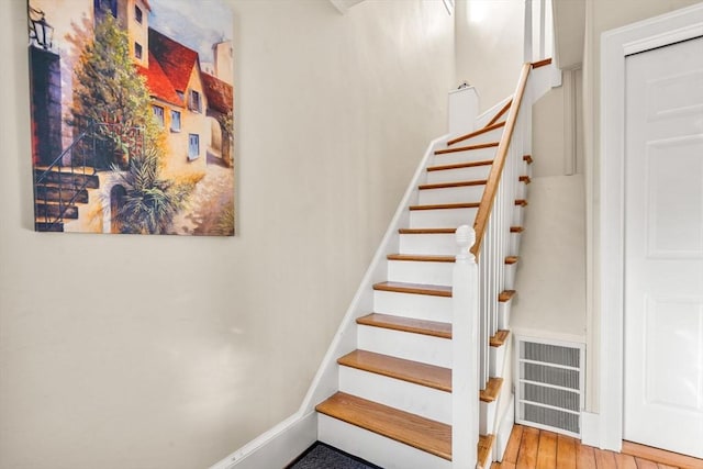 stairway with wood-type flooring