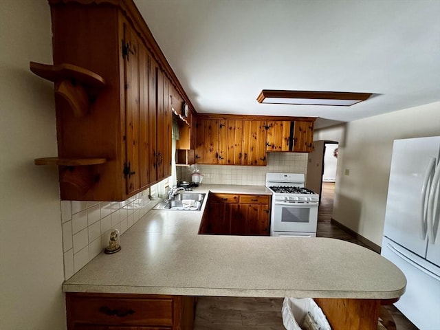 kitchen with open shelves, white appliances, a sink, and light countertops