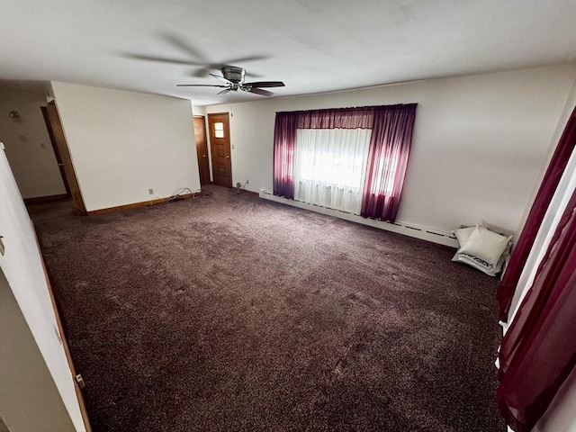 spare room featuring carpet, baseboards, baseboard heating, and a ceiling fan