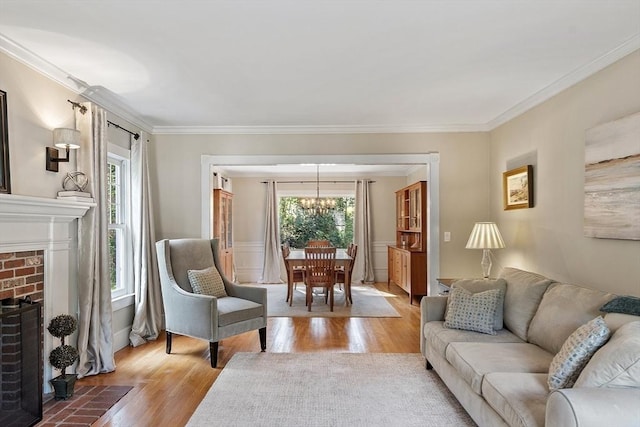 74 Charter Rd, Acton, MA 01720 - living room featuring wood finished floors, healthy amount of natural light, ornamental molding, and a chandelier