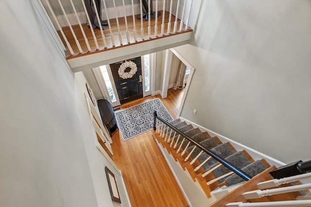 74 Charter Rd, Acton, MA 01720 - stairway with a high ceiling and wood finished floors
