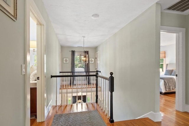 74 Charter Rd, Acton, MA 01720 - hall with an upstairs landing and wood finished floors