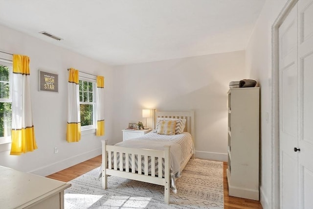 74 Charter Rd, Acton, MA 01720 - bedroom with multiple windows and light wood-type flooring