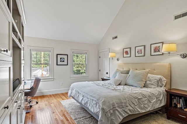 74 Charter Rd, Acton, MA 01720 - bedroom featuring light wood finished floors, high vaulted ceiling, and an office area