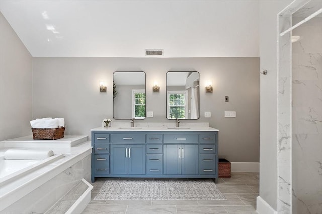 74 Charter Rd, Acton, MA 01720 - full bathroom featuring double vanity, a garden tub, and marble finish floors