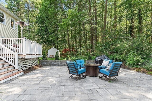 74 Charter Rd, Acton, MA 01720 - view of patio with an outdoor fire pit, stairway, and a wooden deck