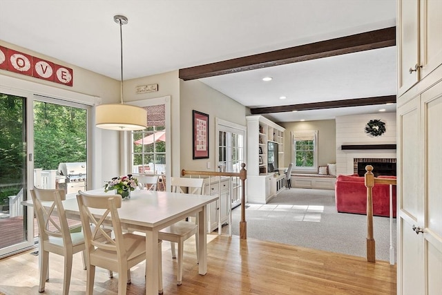 74 Charter Rd, Acton, MA 01720 - dining room with beamed ceiling, light wood finished floors, recessed lighting, and a fireplace
