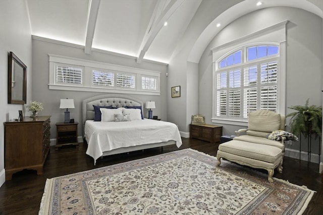 bedroom with lofted ceiling with beams and dark hardwood / wood-style floors