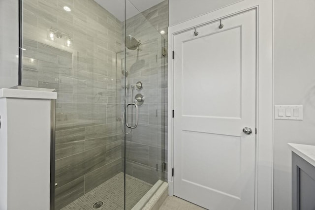 bathroom with vanity and an enclosed shower