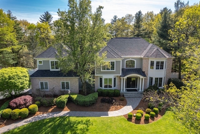 view of front of home with a front lawn