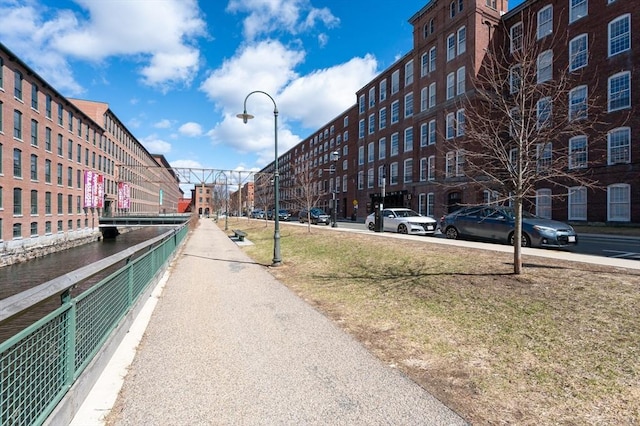 view of road featuring sidewalks and street lights