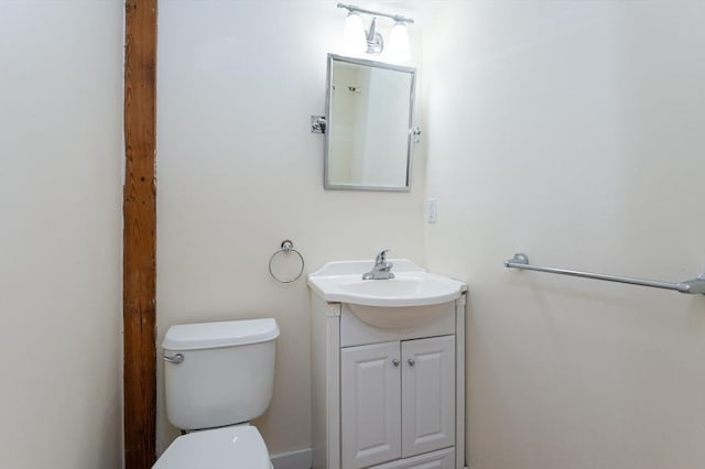 half bath with vanity and toilet