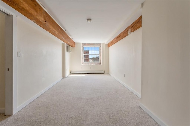 unfurnished room with light colored carpet, a baseboard radiator, and baseboards