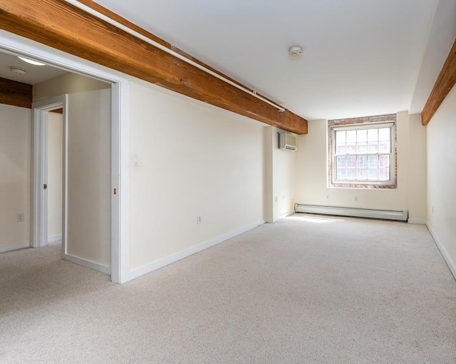 carpeted empty room featuring a baseboard heating unit, baseboards, and a wall mounted air conditioner