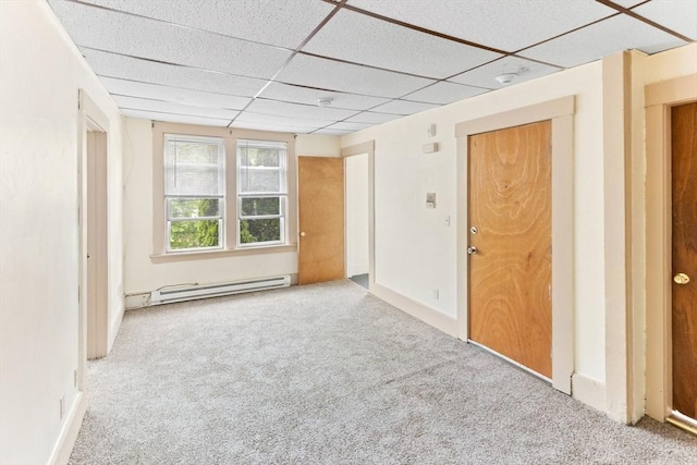 342 Broadway, North Attleboro, MA 02760 - unfurnished room featuring a baseboard heating unit, carpet flooring, a paneled ceiling, and a smoke detector