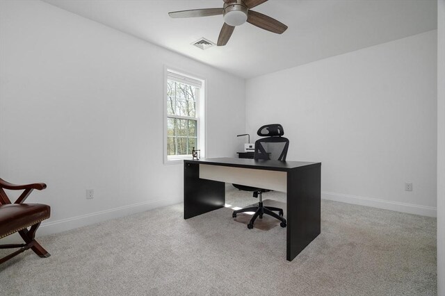 home office featuring visible vents, baseboards, ceiling fan, and carpet floors