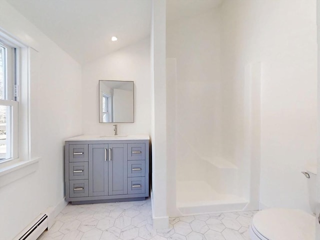 bathroom featuring lofted ceiling, toilet, baseboard heating, a stall shower, and vanity