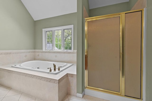 full bathroom featuring tile patterned flooring, a whirlpool tub, a stall shower, and vaulted ceiling