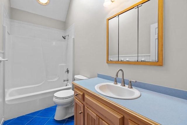 full bathroom featuring toilet, tile patterned floors, vanity, and shower / tub combination