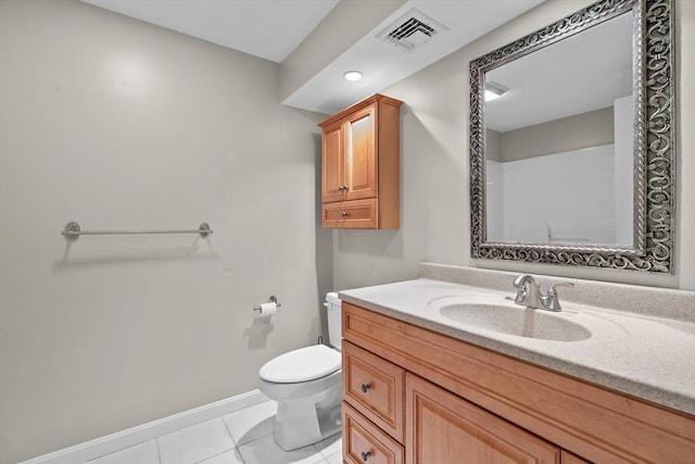 bathroom featuring toilet, baseboards, vanity, and tile patterned floors