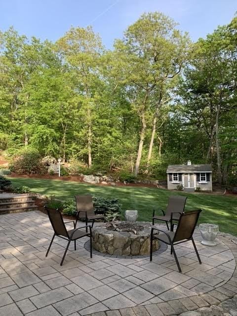 view of patio / terrace featuring an outbuilding