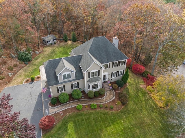 view from above of property featuring a heavily wooded area