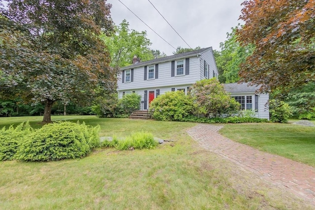 22 Liberty St, Bellingham, MA 02019 - colonial house featuring a chimney and a front yard