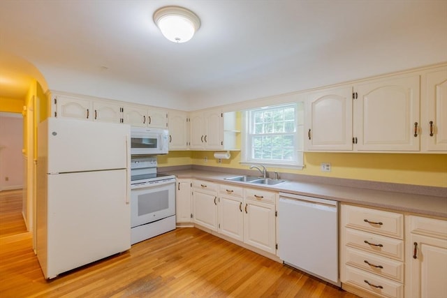 22 Liberty St, Bellingham, MA 02019 - kitchen featuring white appliances, light wood-style flooring, and light countertops
