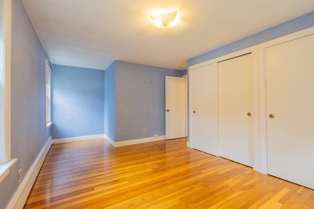 22 Liberty St, Bellingham, MA 02019 - unfurnished bedroom featuring light wood-style flooring and baseboards